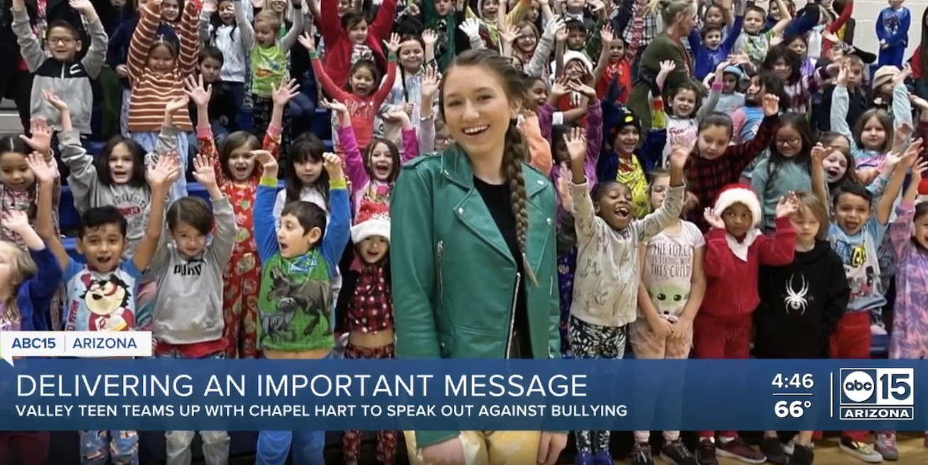 Children cheering together at a school assembly
